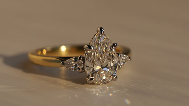 Pear Cut 3 Stone Yellow Gold Ring with Platinum Prongs