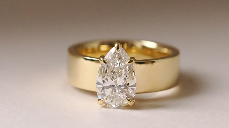 Pear Cut Yellow Gold Wide Band Solitaire