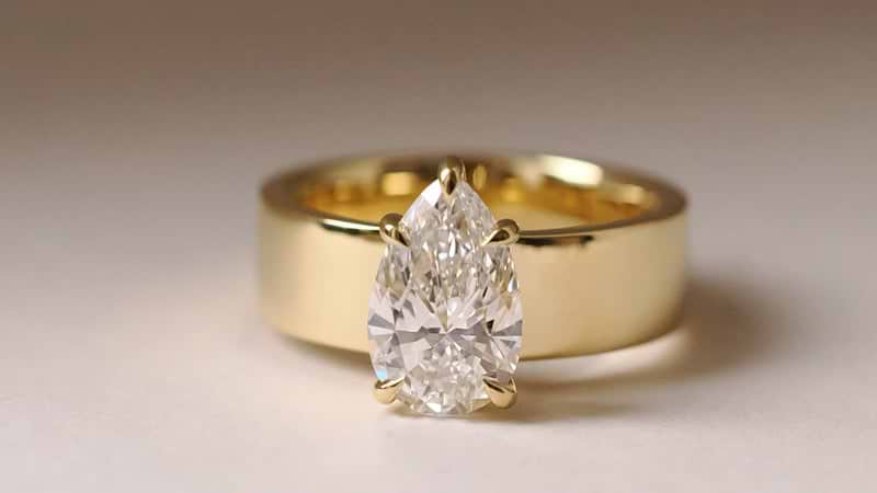 Pear Cut Yellow Gold Wide Band Solitaire