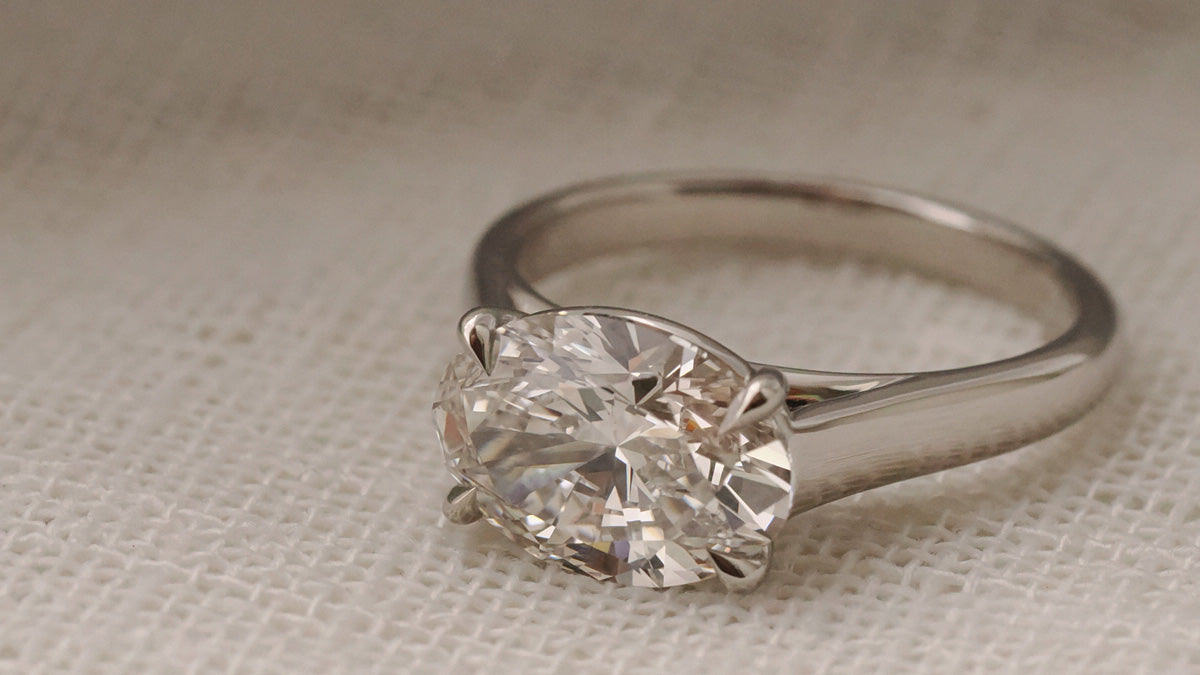 Oval Cut east west cathedral bezel in white gold
