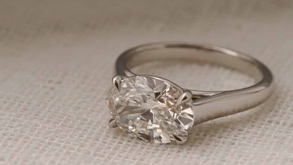 Oval Cut east west cathedral bezel in white gold