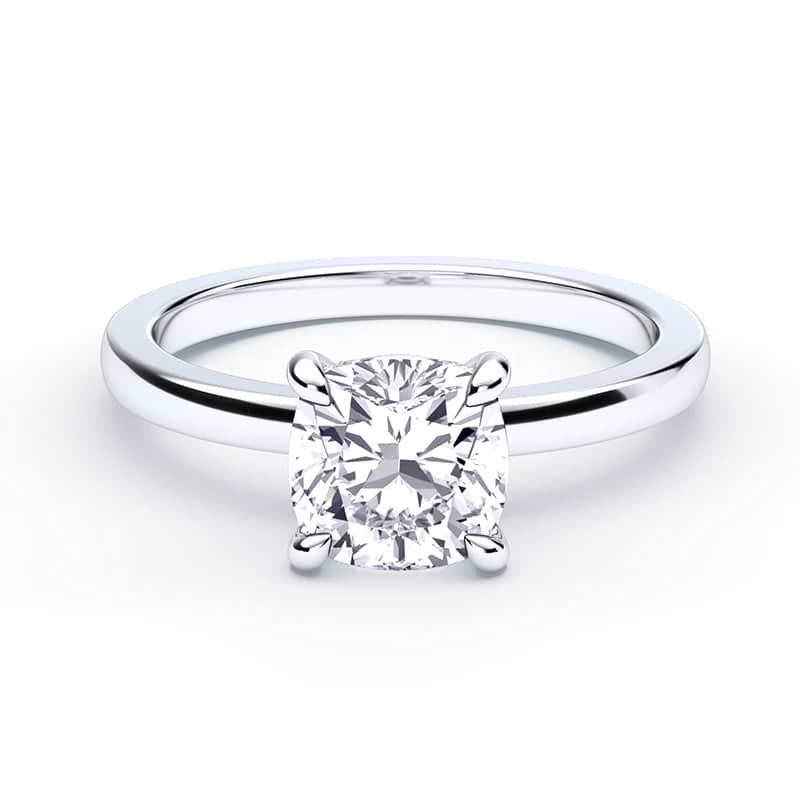 cushion cut diamond ring with a white gold band