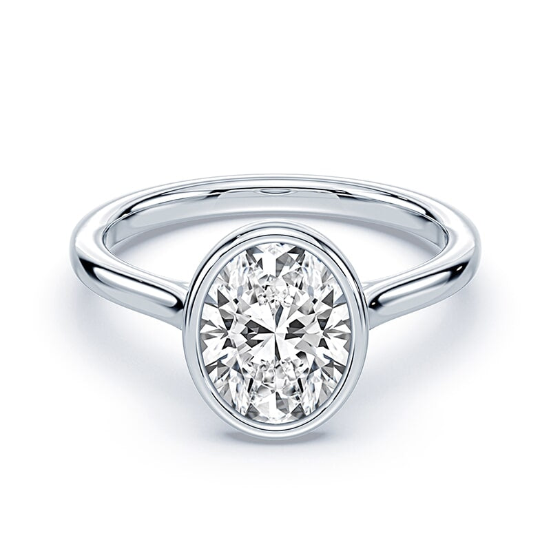 white gold bezel set oval cut diamond engagement ring