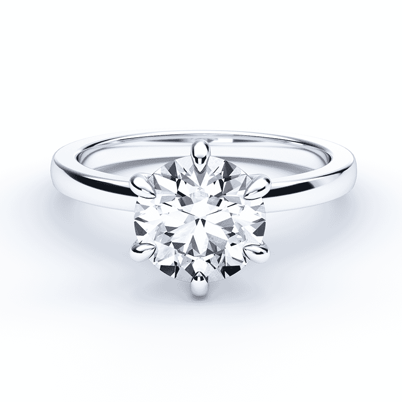 six prong round cut diamond engagement ring on a solid white gold band