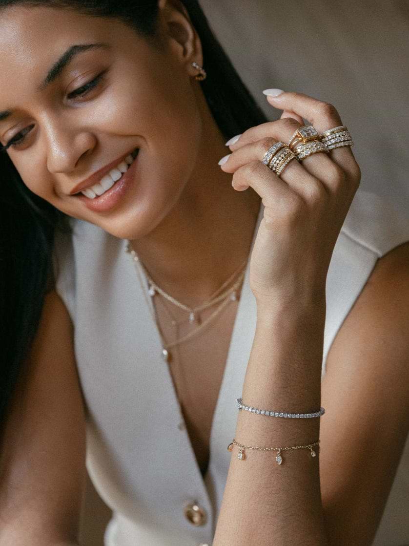 Woman with jewelry smiling in a close-up shot