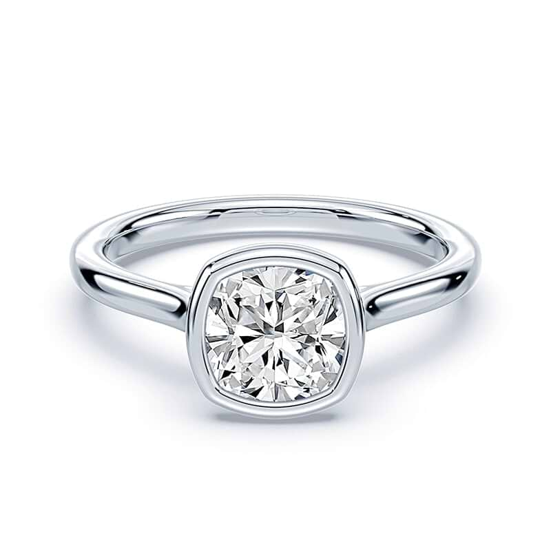 white gold cushion cut diamond engagement ring with bezel setting