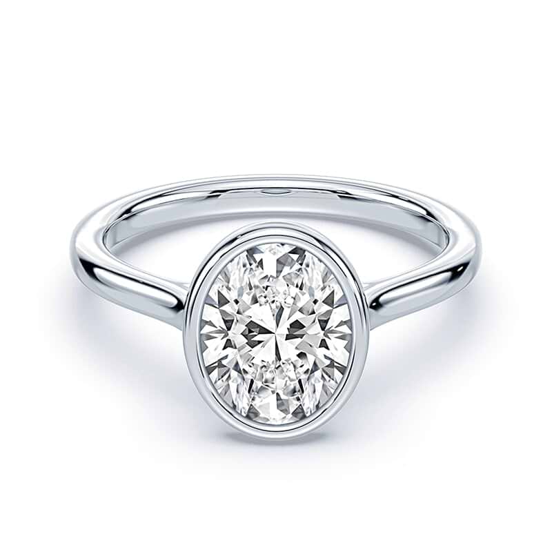 white gold bezel set oval cut diamond engagement ring