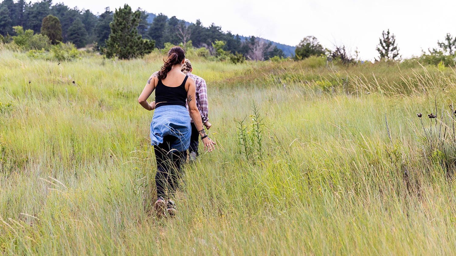 Women walking up a hill during the spring time