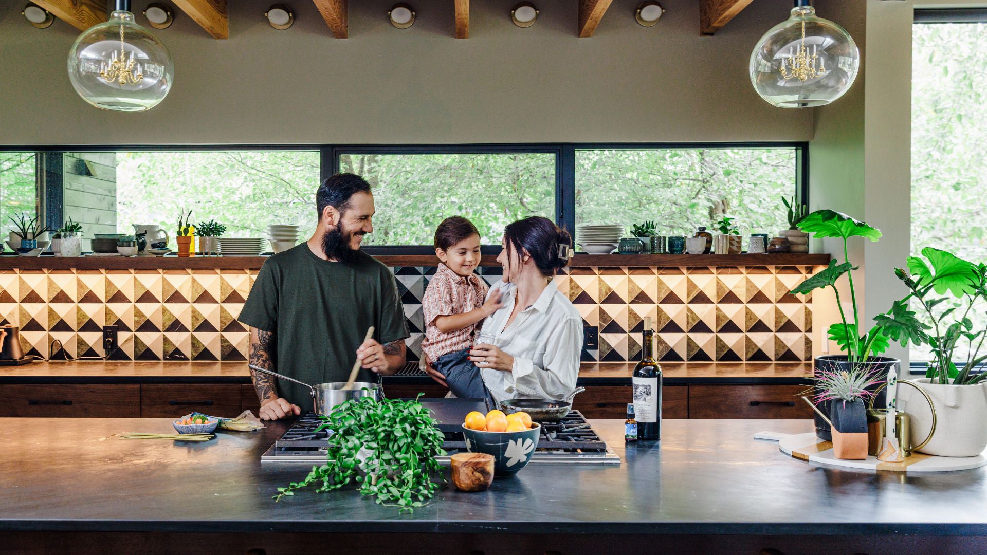 Family in a modern kitchen preparing food together