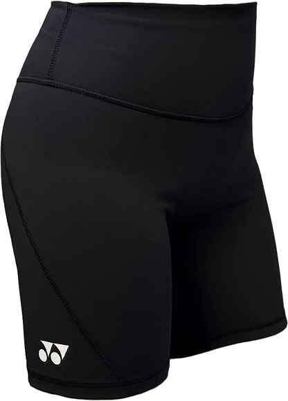 The Yonex YTS2024 Womens Core Badminton Shorts in black feature a small white logo, high-waisted moisture-wicking fabric, and smooth, stretchy material—ideal for sports or workouts. Shown worn in the image. Brand: Yonex.