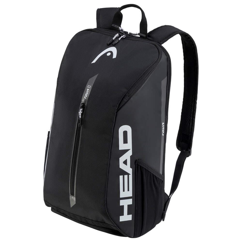 The HEAD Tour Badminton Backpack in black and white showcases a stylish design. It includes a main zippered compartment, a front zipper pocket, side pockets, and a special compartment for rackets. The HEAD logo is prominently displayed in white on the front. For added comfort, it features padded adjustable shoulder straps.