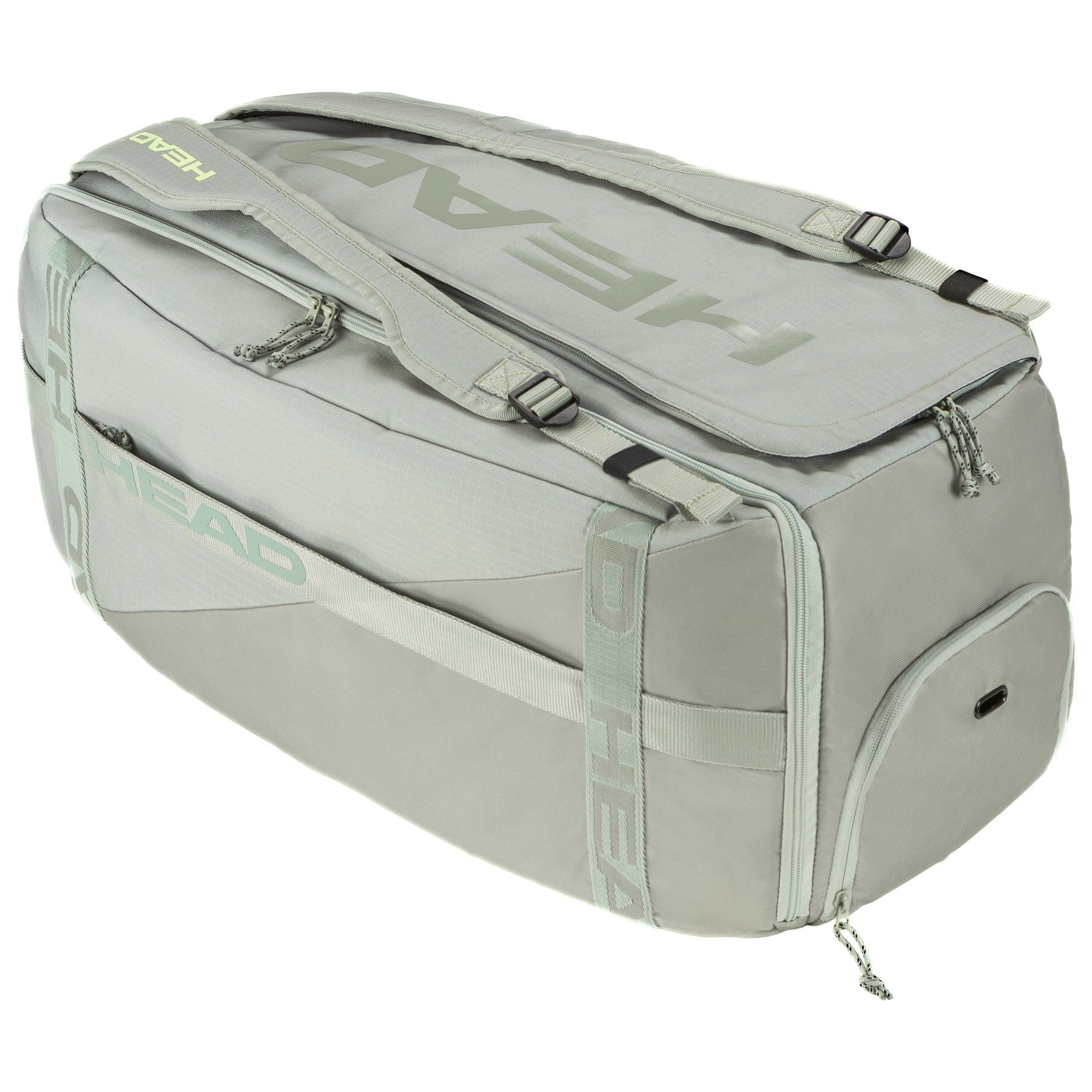 The light gray HEAD Pro Badminton Duffle Bag L LNLL features spacious compartments and adjustable shoulder straps for maximum convenience. It includes multiple zippered sections and is equipped with Climate Control Technology to maintain your gear in optimal condition.
