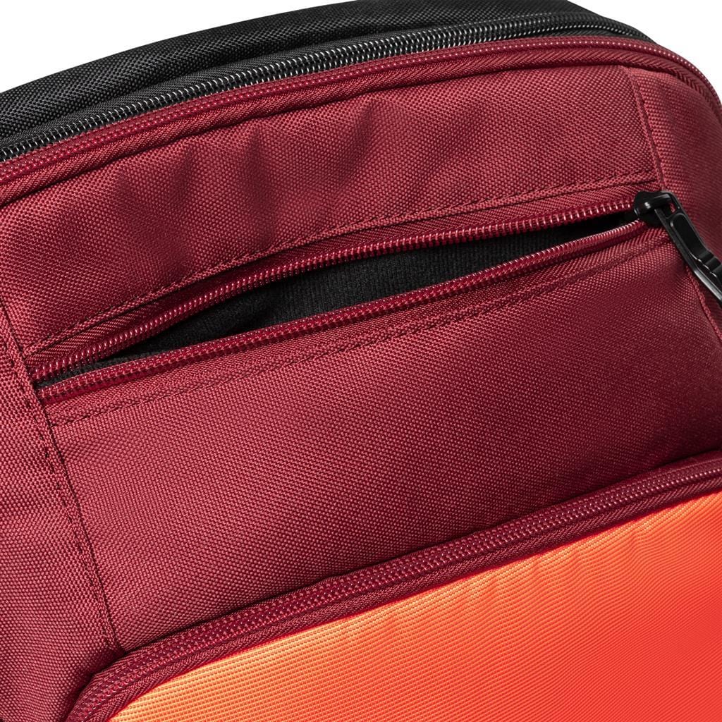 Here's a close-up of the Dunlop CX Performance Badminton Backpack in Black/Red, crafted for badminton enthusiasts. This backpack includes a dedicated racket holder, ensuring secure and stylish storage for your gear.