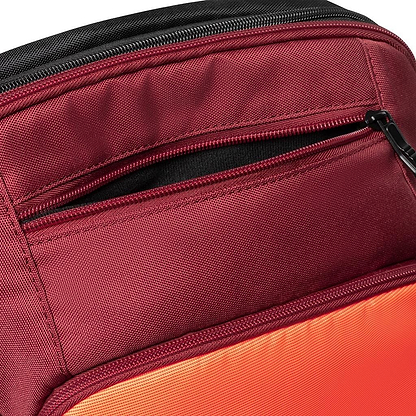 Here's a close-up of the Dunlop CX Performance Badminton Backpack in Black/Red, crafted for badminton enthusiasts. This backpack includes a dedicated racket holder, ensuring secure and stylish storage for your gear.