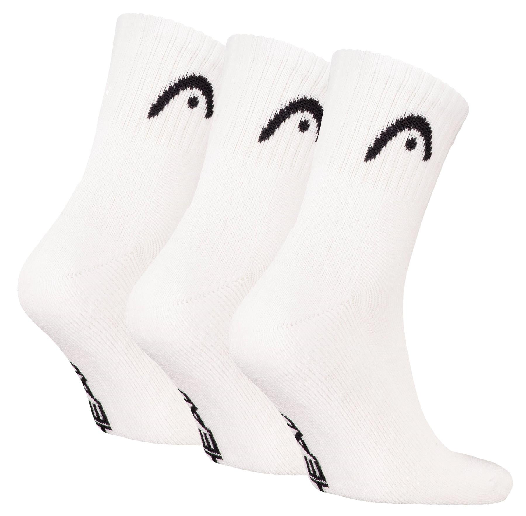 Three pairs of HEAD Club Short Crew Badminton Socks in white, featuring a black logo on the ankle, black text on the toe, and cushioned soles, are arranged side by side.