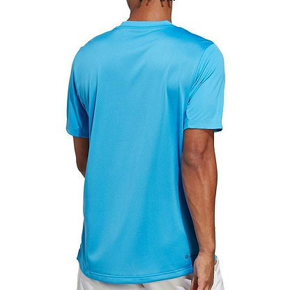 A man wearing an adidas Men's Club Badminton T-Shirt in Pulse Blue.