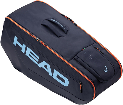 The HEAD Pro 9 Racket Badminton Bag L - Navy features orange zipper accents, a top handle, light blue HEAD logo, CCT+ climate control tech, and multiple compartments including a small top zip pocket; inspired by Jannik Sinner.