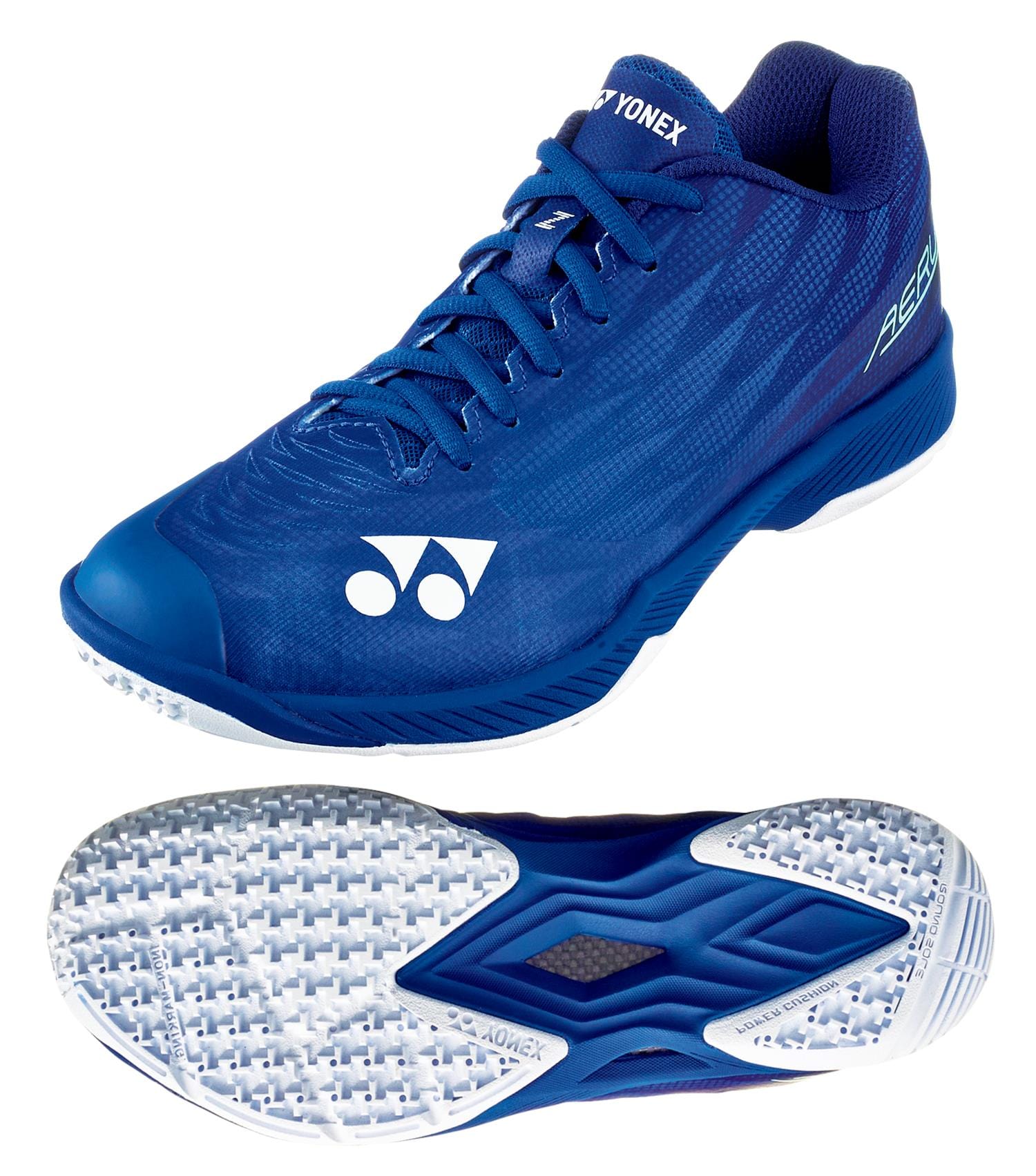 The Yonex Power Cushion Aerus Z2 Women's Badminton Shoes in Navy Blue are designed for agility, featuring a sleek design with the Power Cushion logo and a textured white sole with detailed tread for optimal grip, ideal for quick maneuvers on the court.