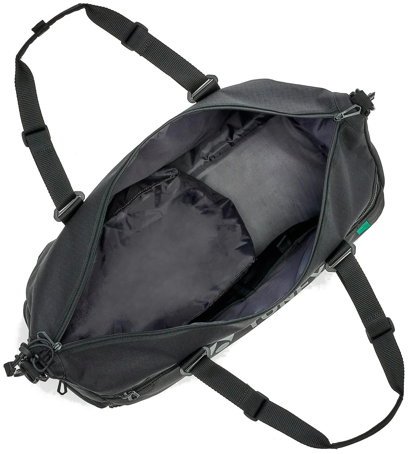 The Yonex BA72611EX Gearlogic Badminton Boston Bag in black is shown from above with its main zipper open, revealing a spacious, empty interior and an inner side pocket.