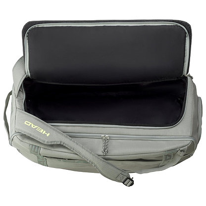 An open HEAD Pro Badminton Duffle Bag L LNLL is displayed, showcasing a gray exterior and a black interior. The bag includes a shoulder strap branded with "HEAD" in light green. With the top flap completely open, it reveals ample compartments inside to accommodate all your gear.