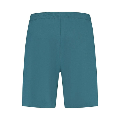 A pair of Indian Teal K-Swiss Hypercourt Men's 7 Inch Badminton Shorts is centered on a white background. The shorts feature a 4-way density stretch for optimal comfort and flexibility, while maintaining a simple design with an elastic waistband and no visible pockets or additional details.