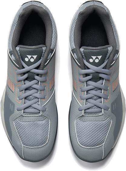 The Yonex Strider Flow Unisex Badminton Shoes in light grey, featuring mesh uppers, light gray laces, and logoed tongues, are ideal for beginner players seeking comfort and style on the court.