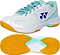 The Yonex Power Cushion SHB 101 Badminton Shoes in White/Mint feature aqua blue laces, light blue interior accents, hexagonal patterns, a blue logo, bright yellow textured soles, and advanced Power Cushion shock absorption for comfort.