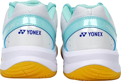 Back view of Yonex Power Cushion SHB 101 Badminton Shoes in white/mint with mesh uppers, light blue accents, and yellow rubber soles. Features Yonex logo and Power Cushion for superior shock absorption on the heel.