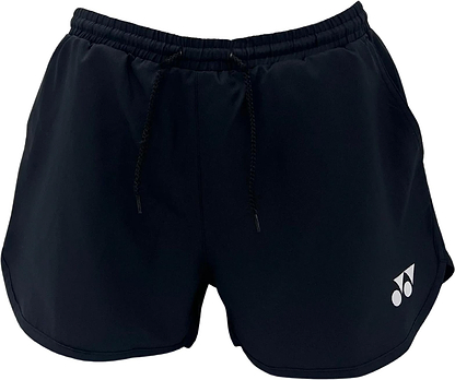 The Yonex YST2024 Womens Badminton Shorts in black feature a drawstring waistband, small white Yonex logo on the lower left leg, loose fit, and quick-drying breathable sports fabric. Brand: Yonex. Displayed against a white background.