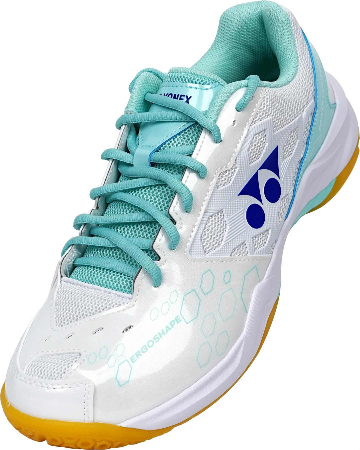 The Yonex Power Cushion SHB 101 Badminton Shoes in White/Mint feature turquoise laces, a light blue interior, yellow outsole, hexagonal side patterns, a blue Yonex logo, and advanced Power Cushion technology for superior comfort.