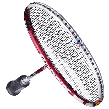 A close-up of the Babolat X-Feel Origin 2026 3U Badminton Racket in white and red shows its tightly strung strings, angled frame, and black grip handle, capturing the power potential of this top-quality Babolat racket.