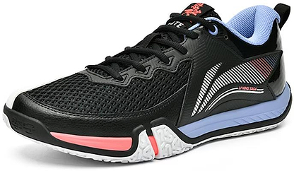 The Li-Ning Saga II Lite Men's Badminton Shoes in black and white feature a mesh upper with stylish red stripes, pink accents near the sole, a light blue lining for enhanced performance, and a contrasting white and purple sole to add flair.