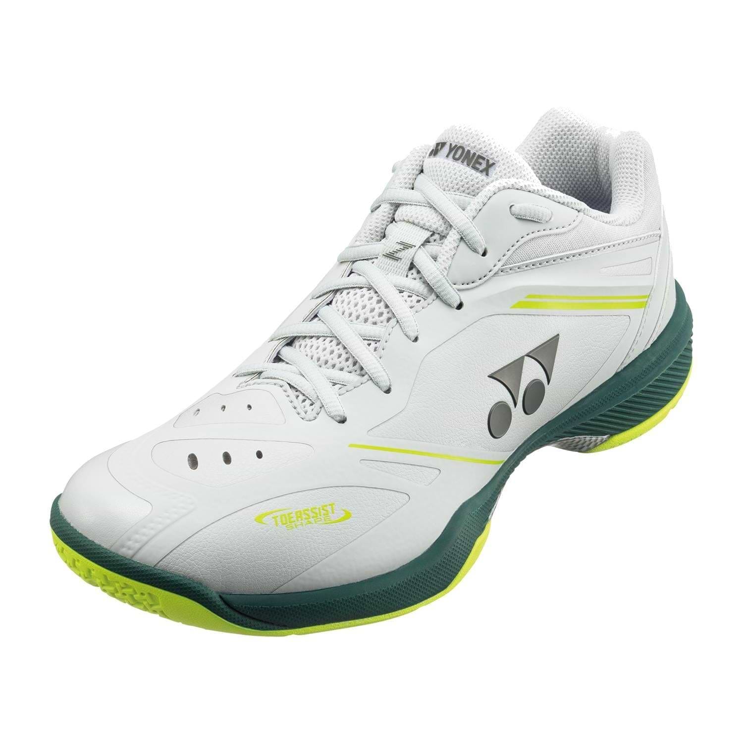The Yonex Power Cushion 65Z4 Viktor Axelsen Men's Wide Badminton Shoes in white and lime feature the Yonex logo, green accents on the sole, neon yellow highlights, and a breathable mesh tongue.