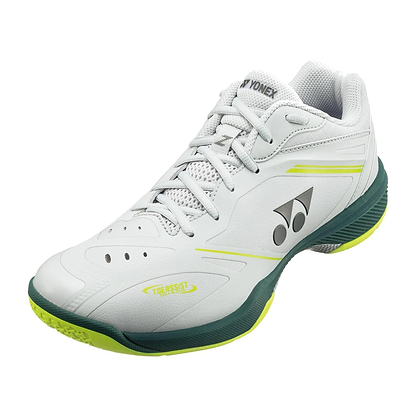 The Yonex Power Cushion 65Z4 Viktor Axelsen Men's Wide Badminton Shoes in white and lime feature the Yonex logo, green accents on the sole, neon yellow highlights, and a breathable mesh tongue.