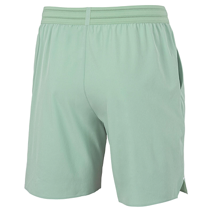 Tecnifibre Team Stretch Men's Badminton Shorts in sage green, shown from the back with an elastic waistband and side pockets, displayed against a plain white background.