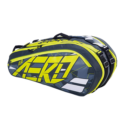 The Babolat RHX6 Pure Aero Racket Bag in grey and yellow showcases a waterproof, durable design. It features bold "Aero" text, eye-catching geometric patterns, white accents, zippers, and handles to complete this stylish tennis essential from Babolat.