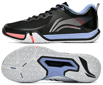 The Li-Ning Saga II Lite Men's Badminton Shoes in black/white feature white and pink accents, a side abstract pattern with logo, anti-slip rubber sole, mesh upper, padded heel for comfort, and Li-Ning Bounce+ technology for superior performance.