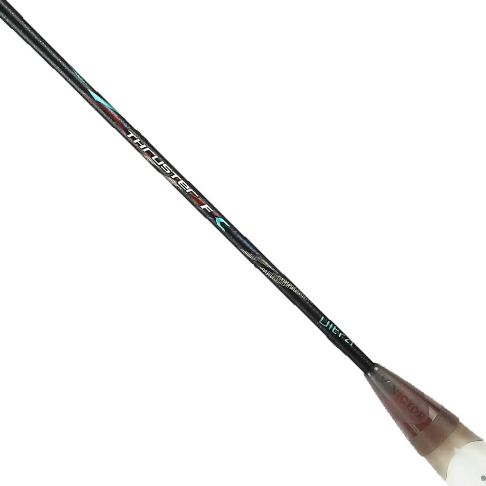 A close-up of the Victor Thruster F C Ultra CX 4U Badminton Racket by Victor in black and gold shows advanced tech on the "Thruster F" labeled shaft, with blue and red accents and a partially visible grip at the handle.