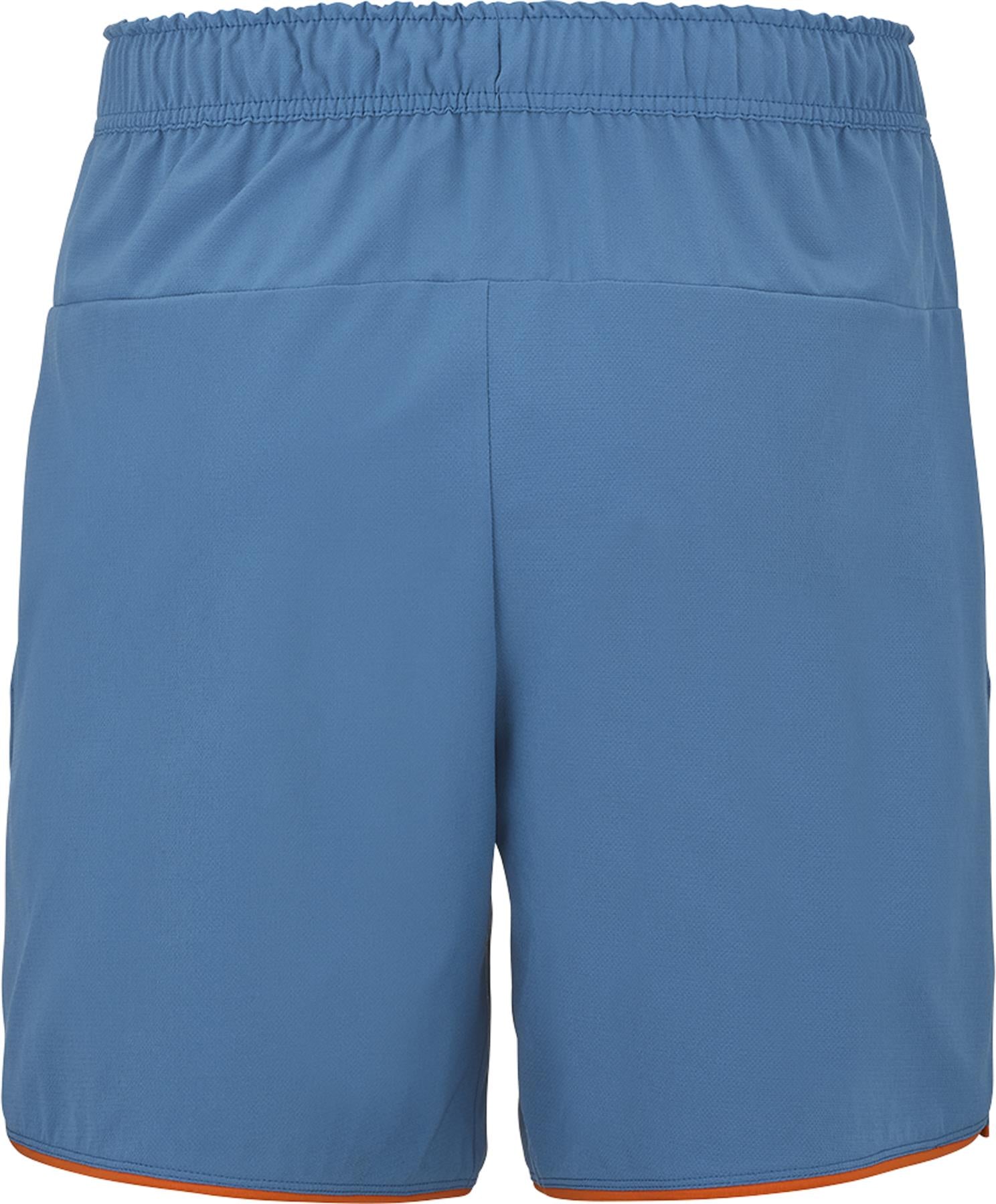 The Babolat Perf Men's Badminton Shorts in Seaport blue feature an elastic waistband and orange trim, shown from the back. These simple, comfortable shorts are perfect for badminton players seeking optimal performance.