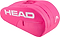 The HEAD Base 6 Racket Badminton Bag M - Pink features a bright pink design with a large white HEAD logo, a small side zippered pocket, and dual top handles for easy carrying.