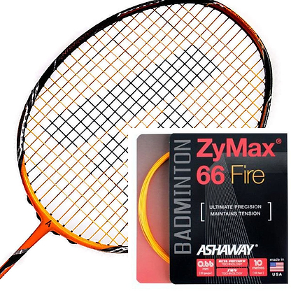 An orange badminton racket with black strings is showcased alongside a stylish black and red packet of Ashaway Zymax 66 Fire Badminton String in Orange (0.66mm - 10m), renowned for its micro gauge strings. The set highlights precision and tension stability, complemented by a vibrant yellow coil.