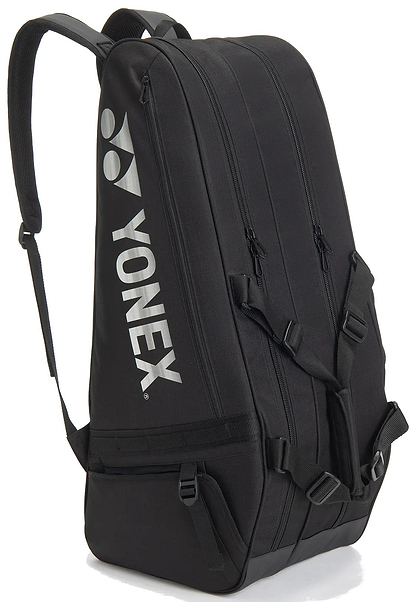 The Yonex BA72626EX Gearlogic 6 Racket Badminton Bag in black features multiple zippered compartments, adjustable shoulder straps, and a white Yonex logo—ideal for serious players seeking reliable storage.