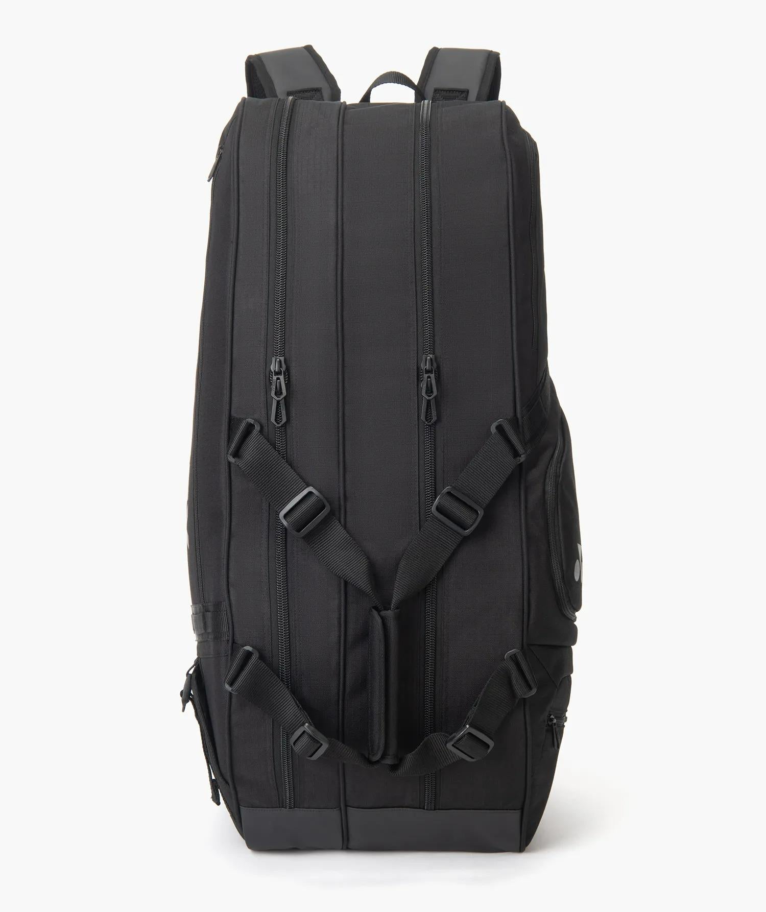 The Yonex BA72626EX Gearlogic 6 Racket Badminton Bag in black features multiple zippered compartments, adjustable shoulder straps, and side pockets, shown upright against a white background.