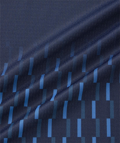 Close-up of the Yonex 10713EX Crew Neck Men's Badminton T-Shirt in Dark Navy, featuring a modern geometric pattern with lighter blue rectangles and excellent moisture management by Yonex.