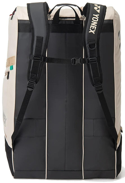 The Yonex BA726212EX Gearlogic 12 Racket Badminton Bag in beige is shown from the back, featuring padded shoulder straps, a chest strap, side pockets, and a top carrying handle.