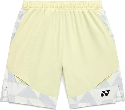 The Yonex 15240YX Knit Men's Badminton Shorts in Champagne feature a light yellow color with white and gray geometric accents, breathable fabric, elastic waistband, side pockets, and a small black Yonex logo on the lower left leg.