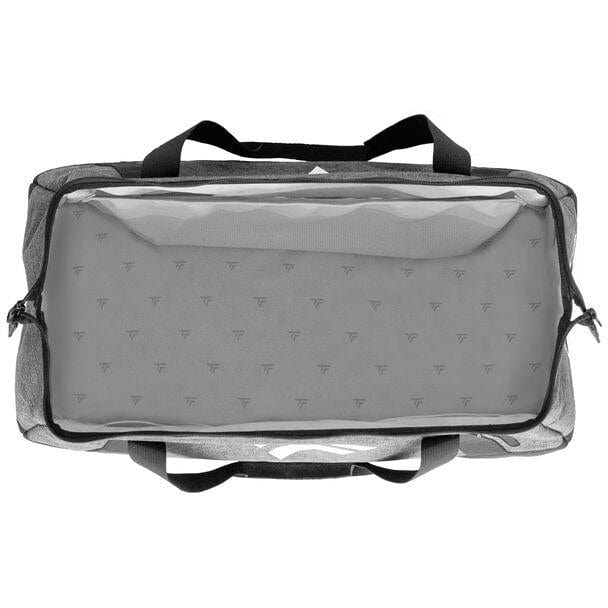 The Tecnifibre All Vision Badminton Duffle Bag - Grey, ideal for racquet sports, boasts a wide-angle opening. This rectangular gym bag with black straps is displayed from the top view, highlighting a spacious main compartment. The patterned interior lining features small, repeating Tecnifibre logos.
