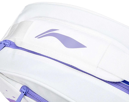 Close-up of the Li-Ning Training Series 3 Racket Badminton Bag in white with a purple zipper and abstract logo on the padded strap. The sleek fabric, branded details, and stylish purple accents keep your badminton gear organized.