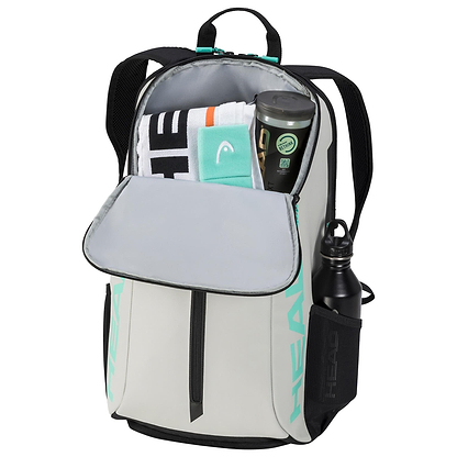 The HEAD Tour Badminton Backpack - CCTE by HEAD showcases a spacious open compartment perfect for storing items like a towel and container. It includes a specialized racket compartment and an exterior pocket for water bottles. This gray backpack, highlighted with black and green accents, is designed to provide practicality for badminton enthusiasts.