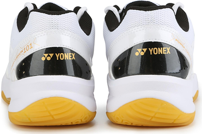 A close-up of the Yonex Power Cushion SHB 101 Badminton Shoes in white and gold shows the Yonex logo on the heel and highlights their Power Cushion technology for superior shock absorption.